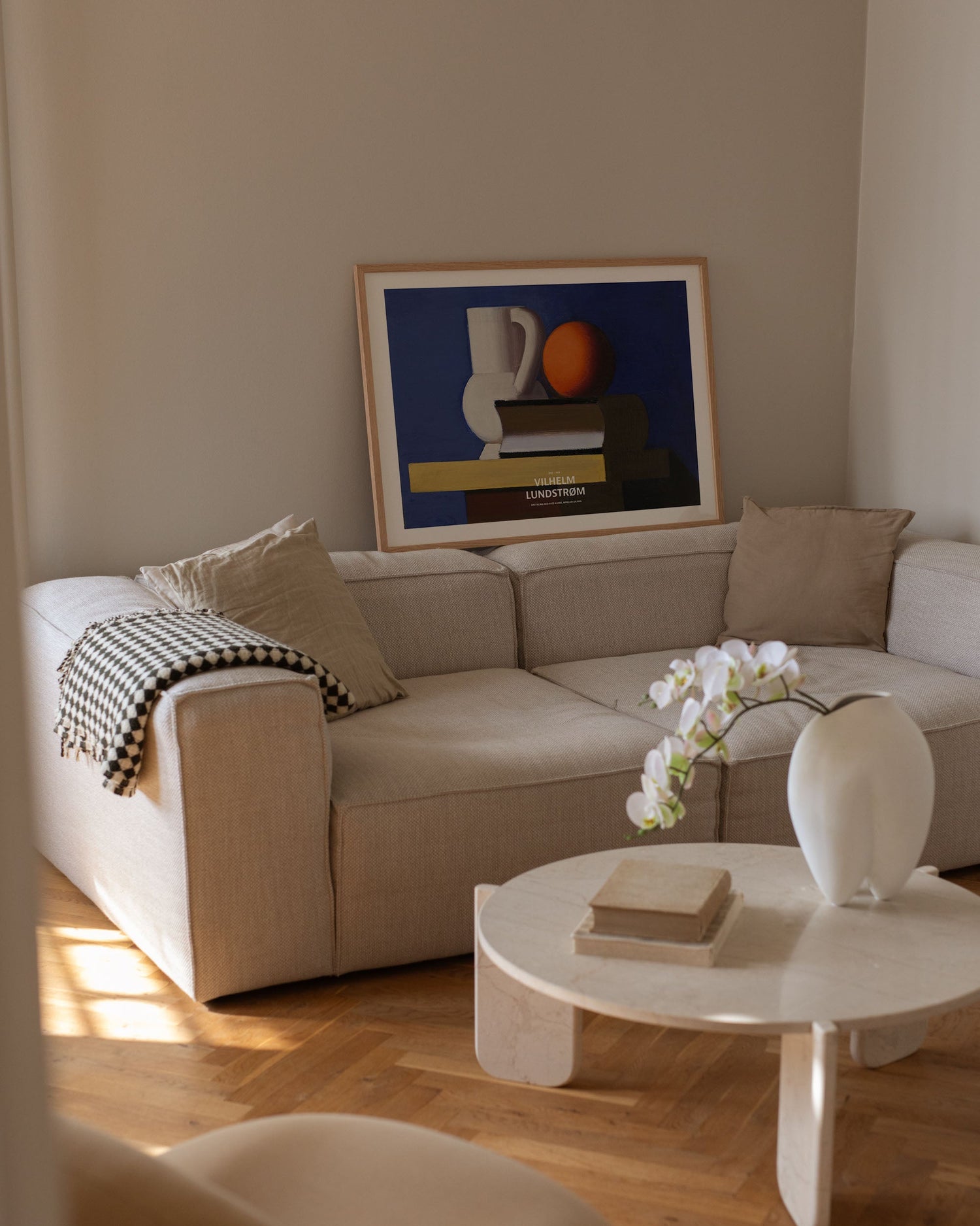 Setup with white jug, orange, and book